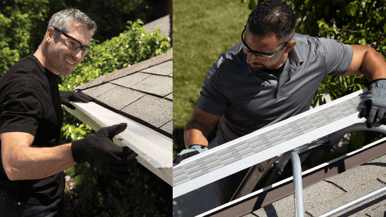 Two men wearing safety glasses and gloves are installing gutter guards on house roofs, each standing on a ladder and working with roofing shingles and protective equipment outdoors.
