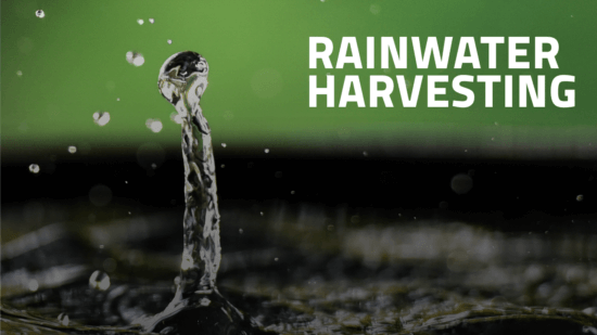 Close-up of a splash of water with droplets in focus, set against a blurred green background. The words Rainwater Harvesting appear in bold white text on the right side.